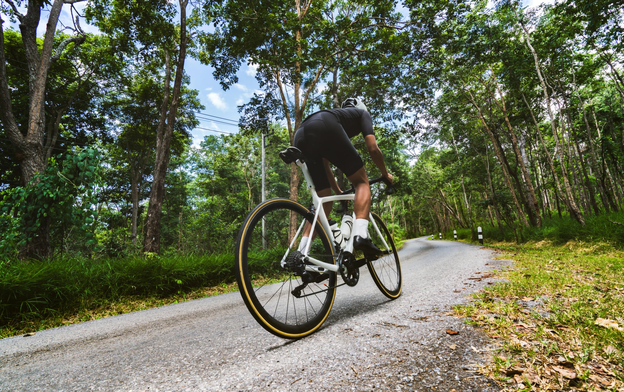 Cyclist He was cycling uphill climb in the woods.