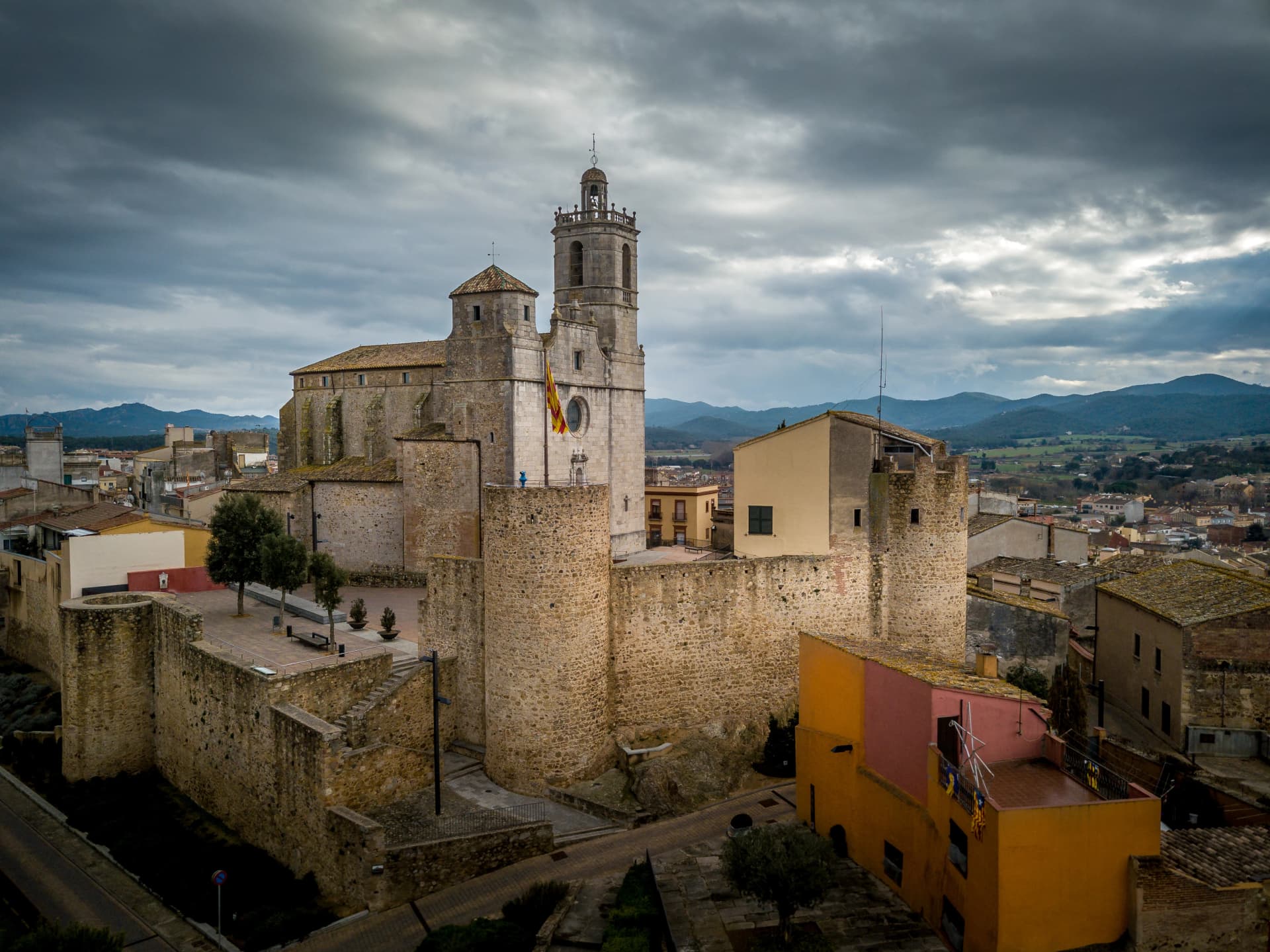 Llagostera near Costa Brava aerial view of church and castle Spain