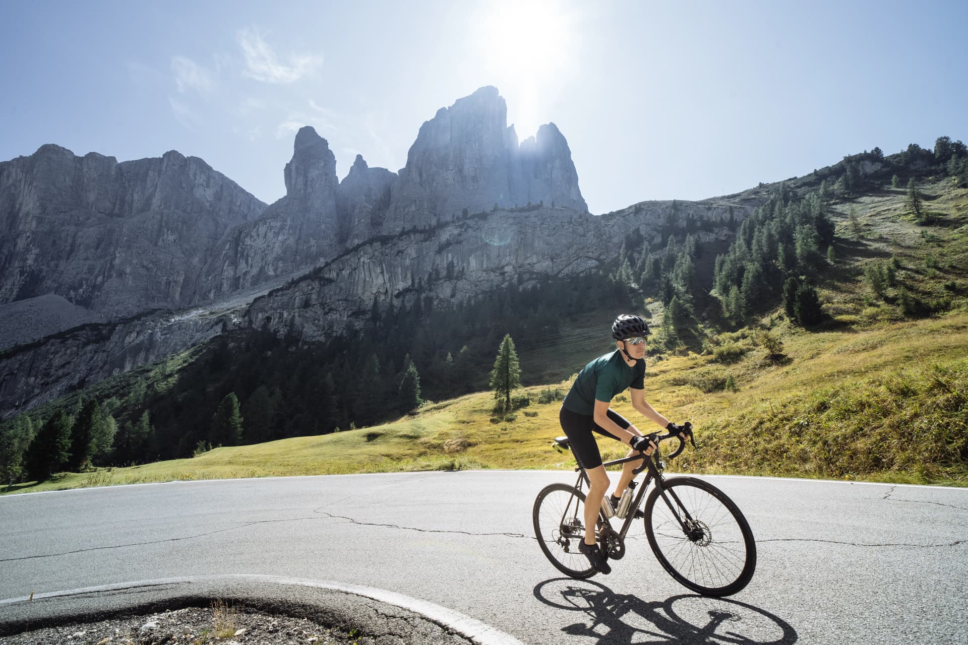 Road cyclist climbing the Italian Dolomites