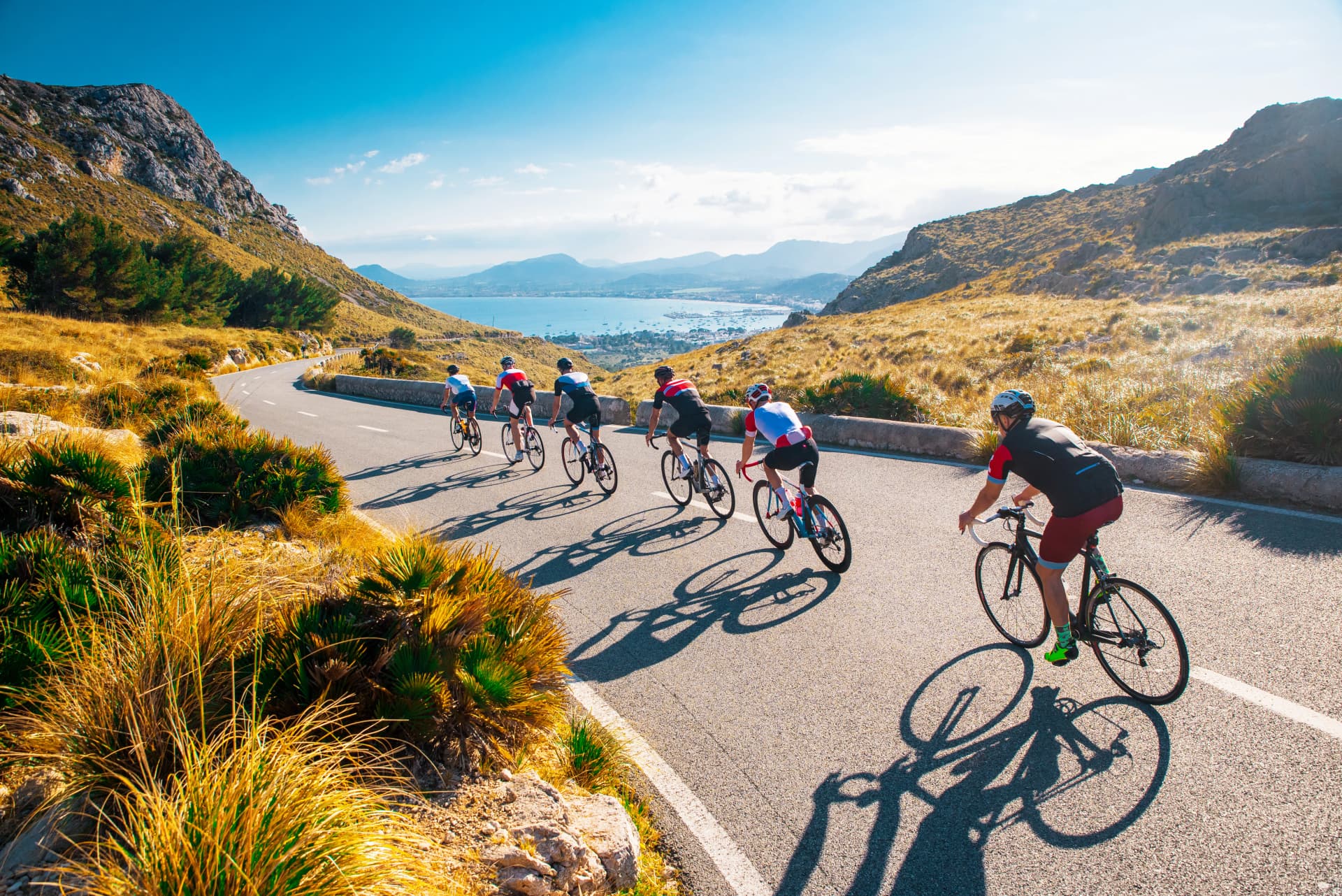 Team sport cyclist photo. Group of triathlete on bicycle ride on the road at Mallorca, Majorca, Spain.