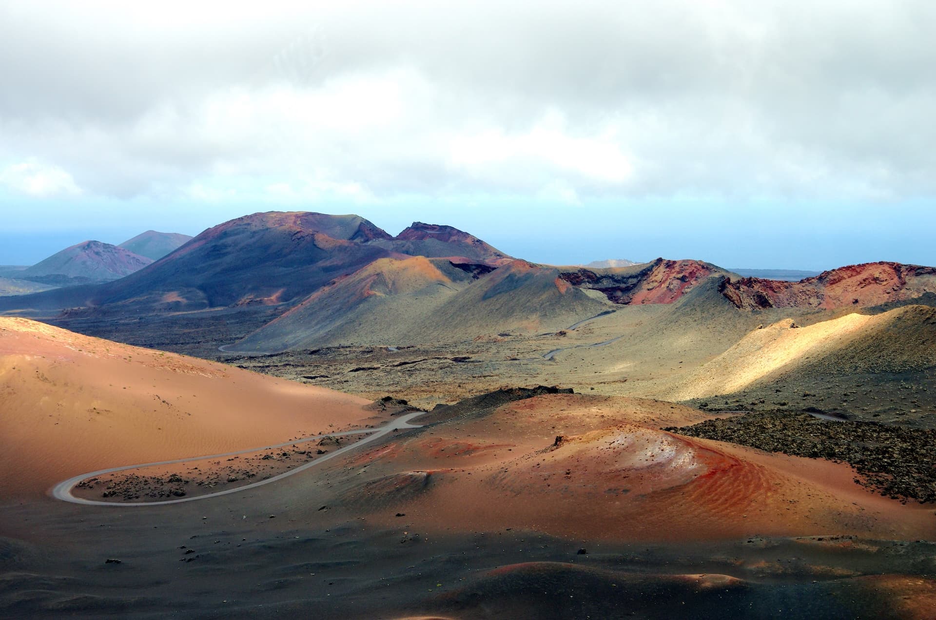 Winding road through the volcanic landscape of Lanzarote, Canary Islands.